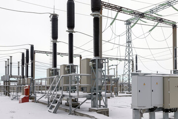 View of a high voltage substation with switches and current transformers.