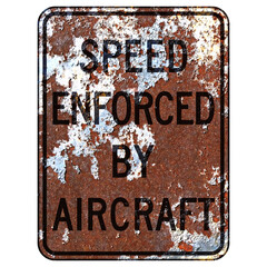 Old rusty American road sign - Speed enforced by aircraft sign, California, New Hampshire, Virginia