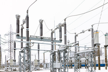 View of a high voltage substation with switches and current transformers. - obrazy, fototapety, plakaty