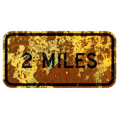 Old rusty American road sign - Two miles alternative
