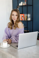 Young woman working at home, cozy portrait indoor
