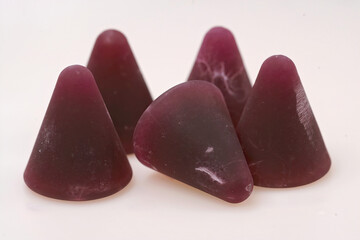 Closeup on a local delicious purple pyramid shaped Cuperdon sweat from Ghent, Belgium