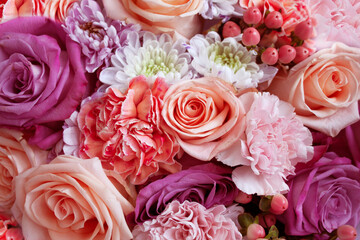 Floral background and wallpaper. Beautiful flowers. Bouquet of roses, hypericum, dianthus and chrysanthemums
