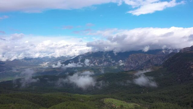 Small Town and Clouds on Mountains Blue Whith Sky 4K Video