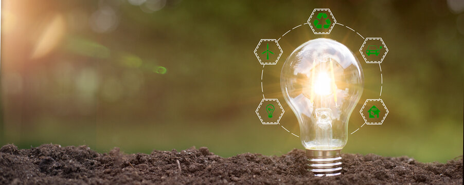 Green energy innovation light bulb with future industry of power generation icon graphic interface. Concept of sustainability development by alternative