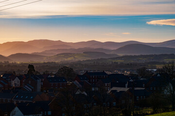 A view overlooking Penrith towards the English Lake District mountains on a hazy winters day