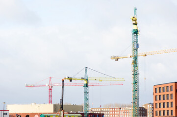 Building under construction with large cranes on top in Nijmegen in the Netherlands