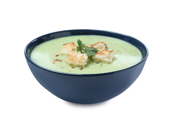 Delicious asparagus soup with croutons and parsley on white background