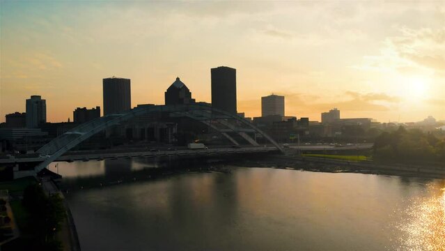 Rochester New York Rising Morning Drone Aerial. view rises up on the city skyline of Rochester New York in the morning with the sunrise