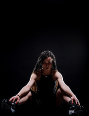 Stylish trendy woman posing while sittin on floor