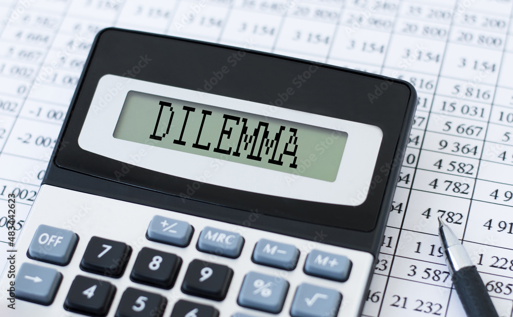 Poster calculator with text dilemma on the screen on the background of financial statements next to it is a