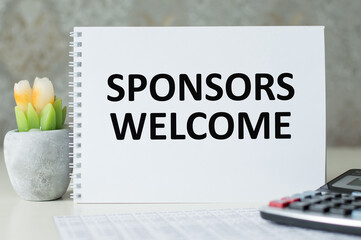 Text Sponsors Welcome on the office desk, business concept, financial support, assistance