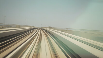Fototapeta na wymiar Metro In Dubai, United Arab Emirates. FPV POV At Fast Speed Drive Motion. driverless metro in blurred . futuristic city skyline in UAE. Long Exposure , , , street Dubai Subway. Tunnel.