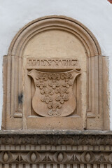 An architectural element on the building of the Museum of the Archdiocese of Wrocław is a bas-relief of the coat of arms with six lilies. The coat of arms with lilies symbolizes the power of the bisho