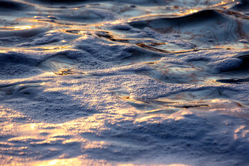 the reflection of the sky in the wind on the water