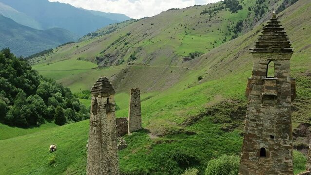 Aerial view of medieval tower complex in the mountains of Ingushetia, Russia, 4k
