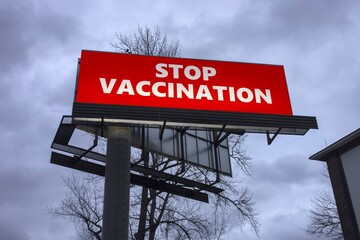 Billboard with text STOP VACCINATION as a protest against vaccines