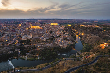 Fototapeta premium Drone point of view old town of Toledo at dusk. Spain