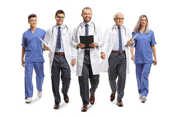 Obraz premium Team of doctors and nurses walking towards camera