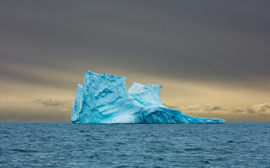 Huge iceberg floating in the sea of Disko Bay, Greenland