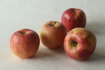 A crop of red fresh juicy apples, randomly placed