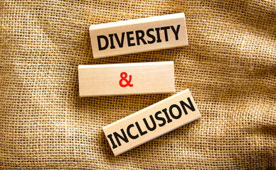 D and I, Diversity and inclusion symbol. Concept words D and I, diversity and inclusion on blocks on beautiful canvas table canvas background. Business, D and I, diversity and inclusion concept.
