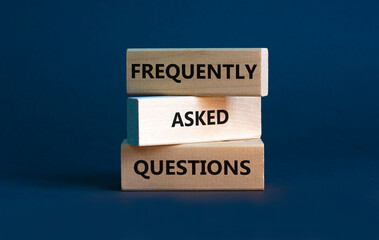 FAQ frequently asked questions symbol. Concept words FAQ frequently asked questions on blocks on beautiful grey table grey background. Business and FAQ frequently asked questions concept. - obrazy, fototapety, plakaty