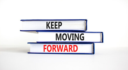 Keep moving forward symbol. Concept words Keep moving forward on books on beautiful white table white background. Business, motivation and keep moving forward concept. Copy space.