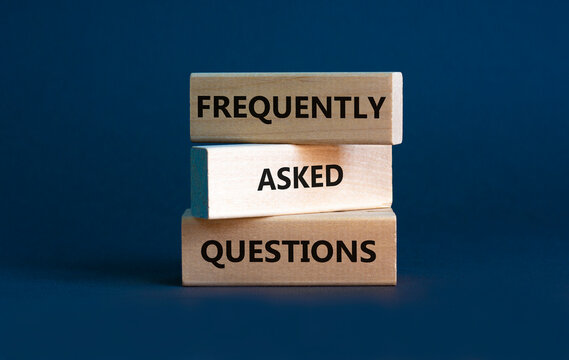 FAQ frequently asked questions symbol. Concept words FAQ frequently asked questions on blocks on beautiful grey table grey background. Business and FAQ frequently asked questions concept.