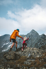 Father and daughter trail running in mountains family travel vacations hiking outdoor adventure...