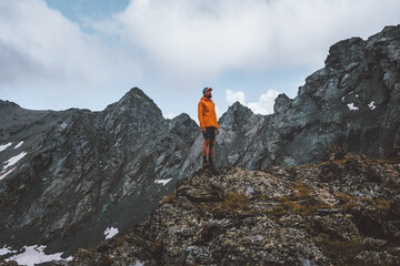 Man trekking alone in mountains travel hiking adventure outdoor active tourism summer vacations healthy lifestyle tourist at one with nature concept 
