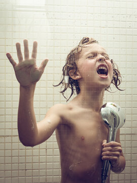 Positive Kid Having Fun In Shower