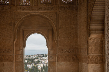 Interior view of the Alhambra palace and its walls decorated with bas-reliefs. Grenade. Andalusia. Spain. - 483471263