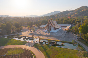 Fototapeta premium Aerial top view of Watdhammayan, Phetchabun City, Thailand. Thai buddhist temple architecture. Tourist attraction landmark.