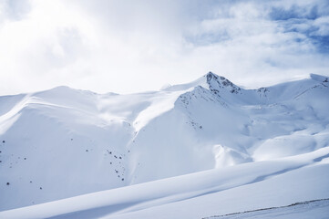 Beautiful landscape winter summer day on snowy mountain in ski resort Arkhyz, Caucasus mountains, Russia
