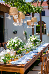 Wedding organization preparation restaurant and wedding planners.Chairs and honeymooners table decorated with candles, served with cutlery and crockery and covered with a table cloth. 