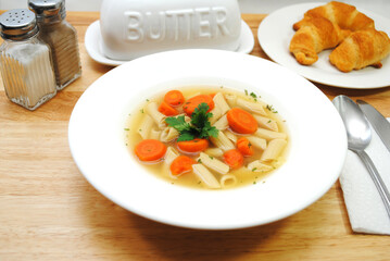 Vegan Penne Vegetable Soup Served in a White Bowl