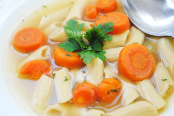 Vegan Penne Vegetable Soup Served in a White Bowl