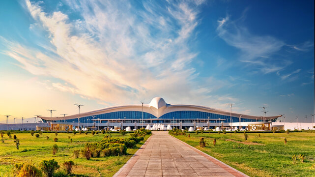 View to Ashgabat International Airport, formerly known as Saparmurat Turkmenbashy International Airport in sunset light. Located within the city limits of Ashgabat, Turkmenistan
