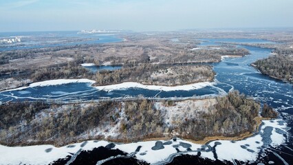 Winter Dnipro river covered with ice.
