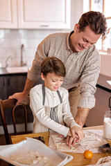 american family having fun prepare bakery cookies together at home. handsome father and adorable son in modern bright kitchen. Happy loving Man support little boy, enjoy making xmas cookies