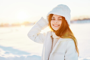 young woman red hair snow field winter clothes Sunny winter day Lifestyle