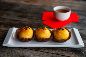 Traditional Chinese New Year Pastry With Tea and Lucky Money Red Packets