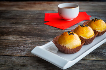 Traditional Chinese New Year Pastry With Tea and Lucky Money Red Packets