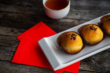 Traditional Chinese New Year Pastry With Tea and Lucky Money Red Packets