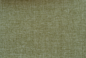 fabric background in green (with a slight shadow in the upper left corner)