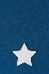 wooden star on blue fabric