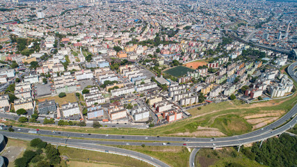 Aerial view of Itaquera, Sao Paulo. Residential buildings, avenues and train