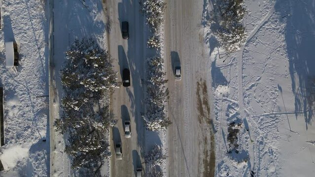 Aerial view, texture, of a Highway with Cars near to fountains, alley, and buildings in Sunset with Long Shadows, Russia