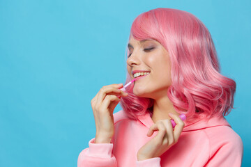 Fototapeta premium young woman with pink hair lipstick makeup Lifestyle fashion